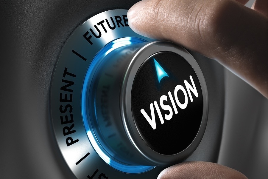 Button vision pointing the future with blur effect plus blue and grey tones. Conceptual image for illustration of company or business anticipation or strategy.